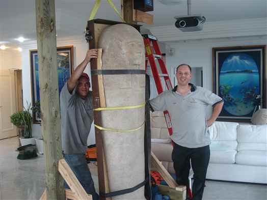 Moving a priceless Egyptian sarcophagus lid.