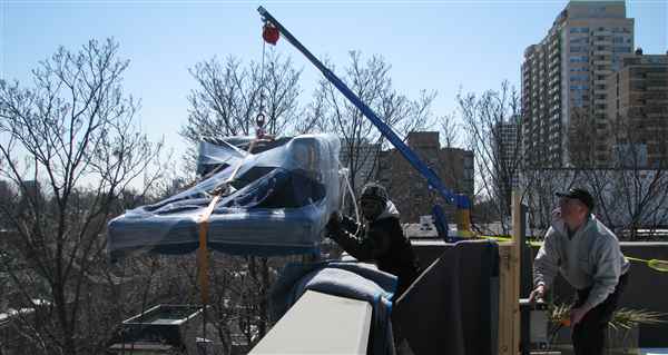 Hoisting a sofa to a 7th floor balcony that would not fit in elevator.