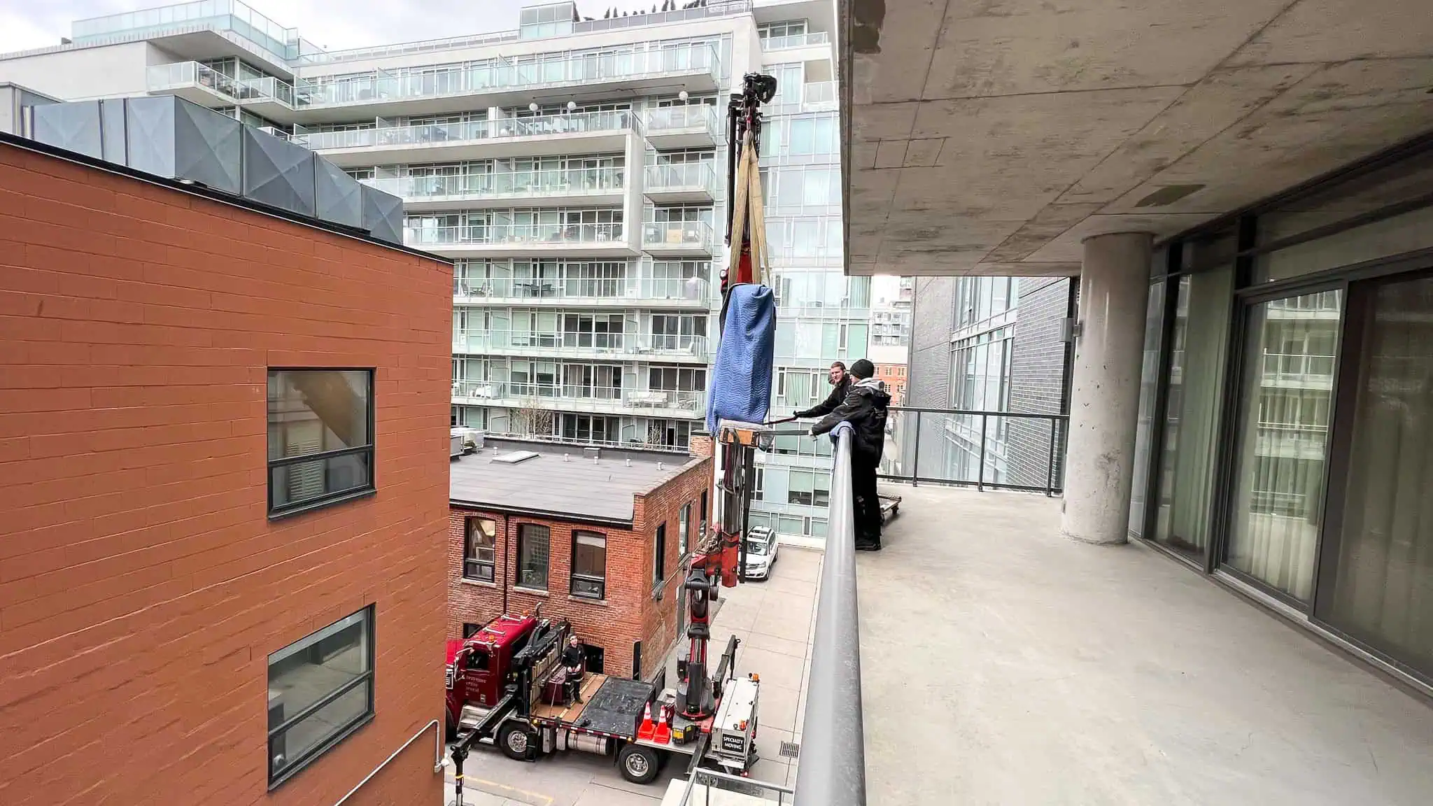 Craning a 7' Bosendorfer Grand piano off a condo balcony.