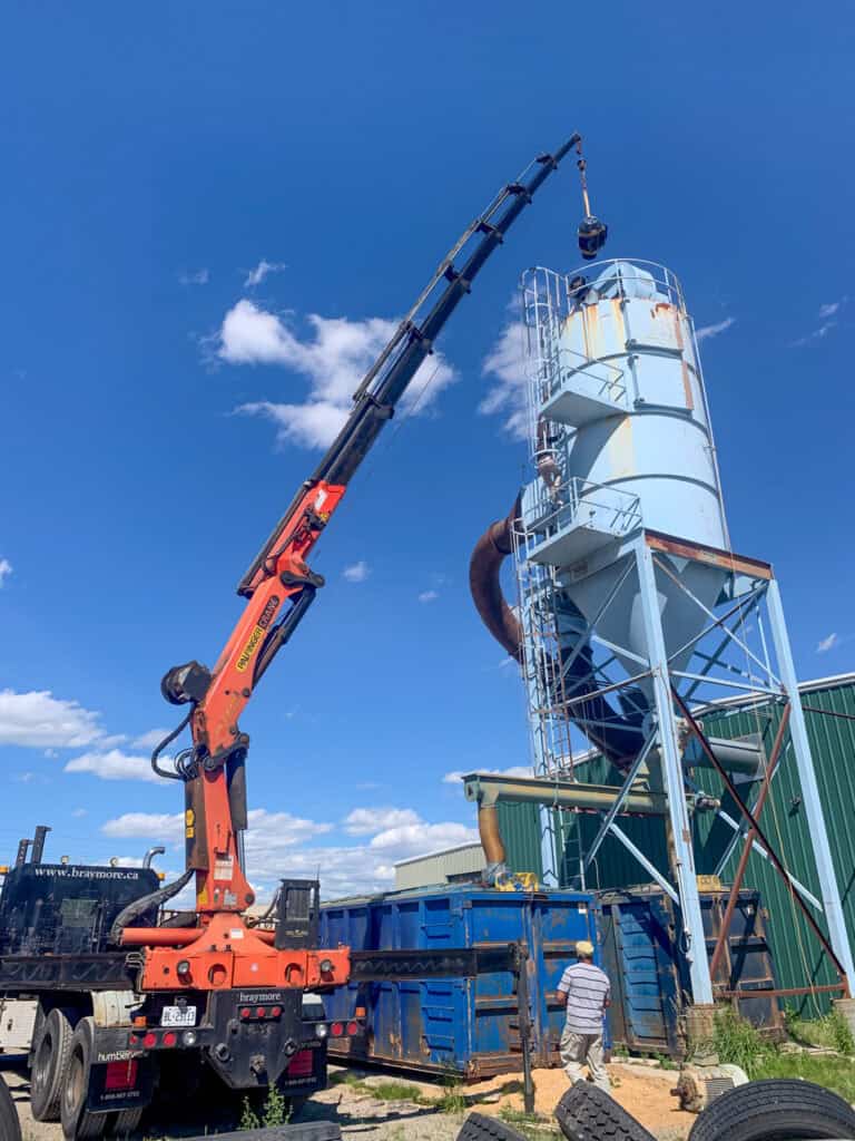 Using crane to lift a motor onto this tower.