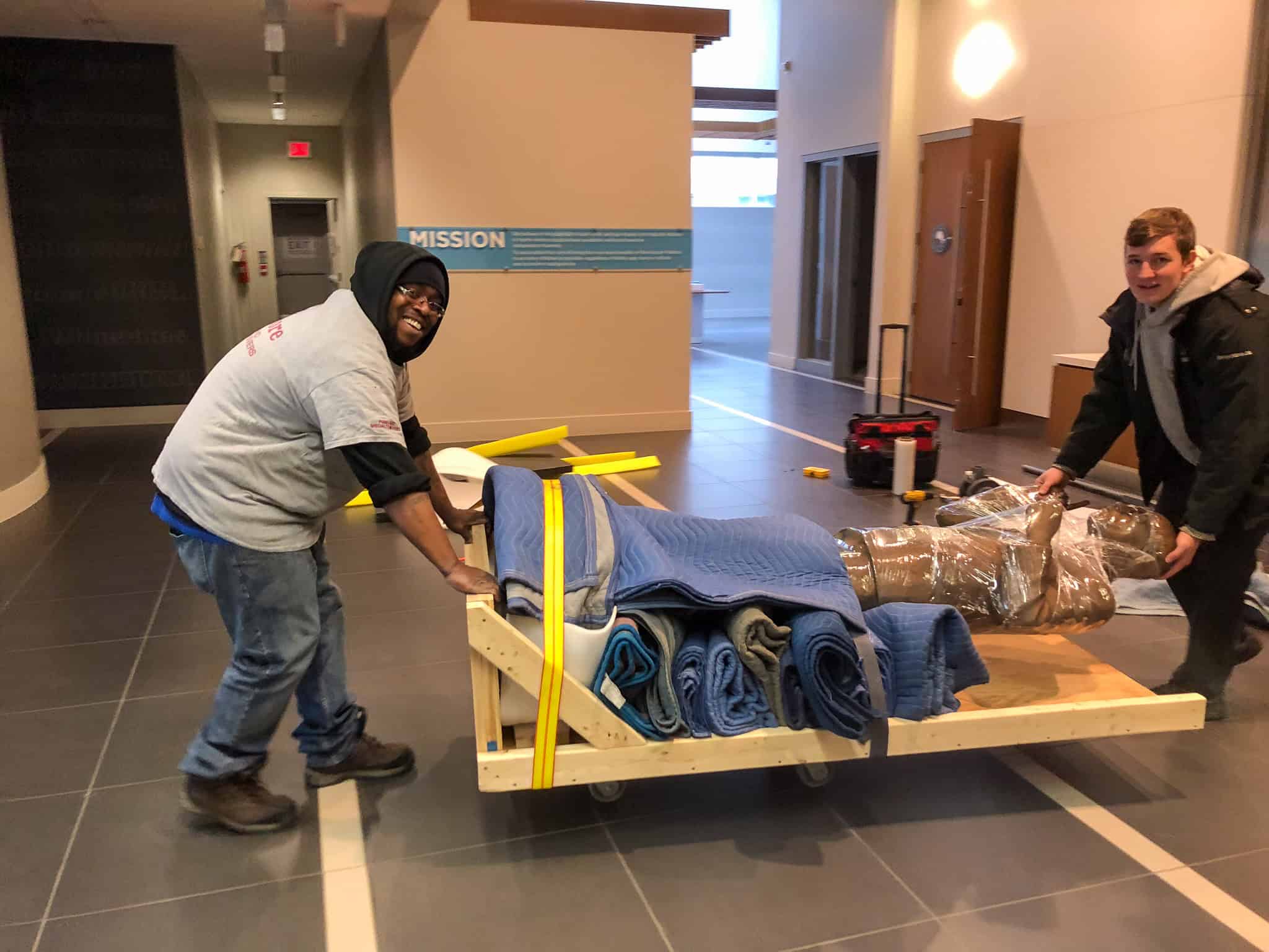 Rolling a thousand pound statue through a building.