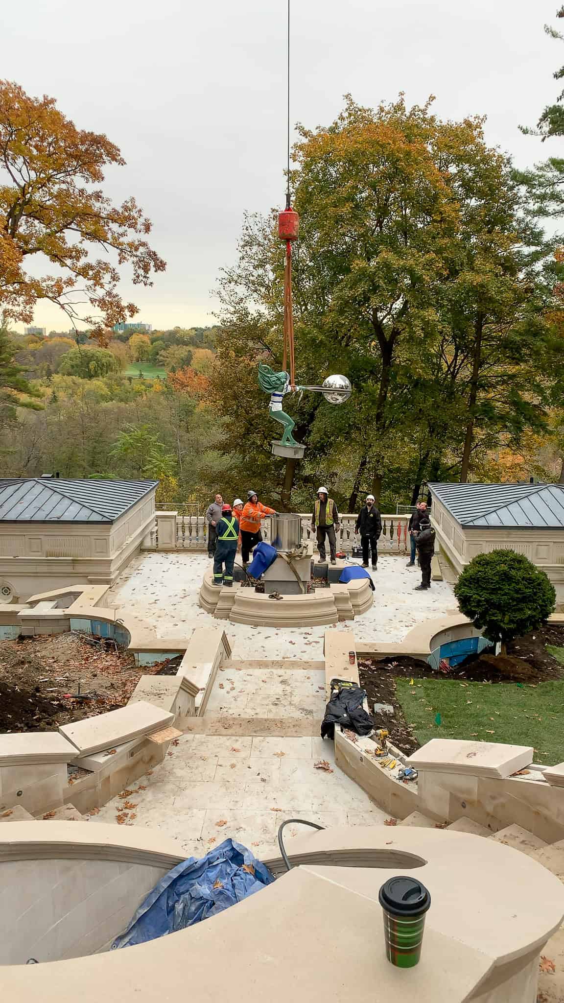 Craning a custom statue over a large home in Toronto.