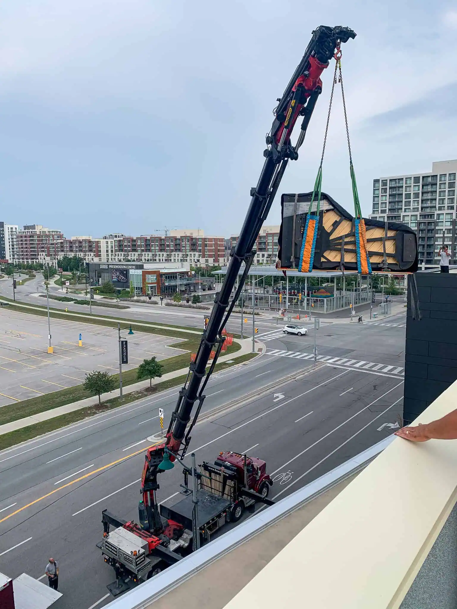Craning a Yamaha 9' concert grand piano into the Yamaha Music School that would not fit in the elevator in Markham.