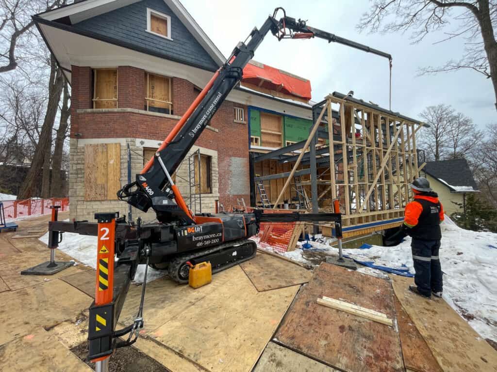 Spider cranes can do all the heavy lifting for you. This crane is lifting lots of heavy steel beams under 20 feet in height.