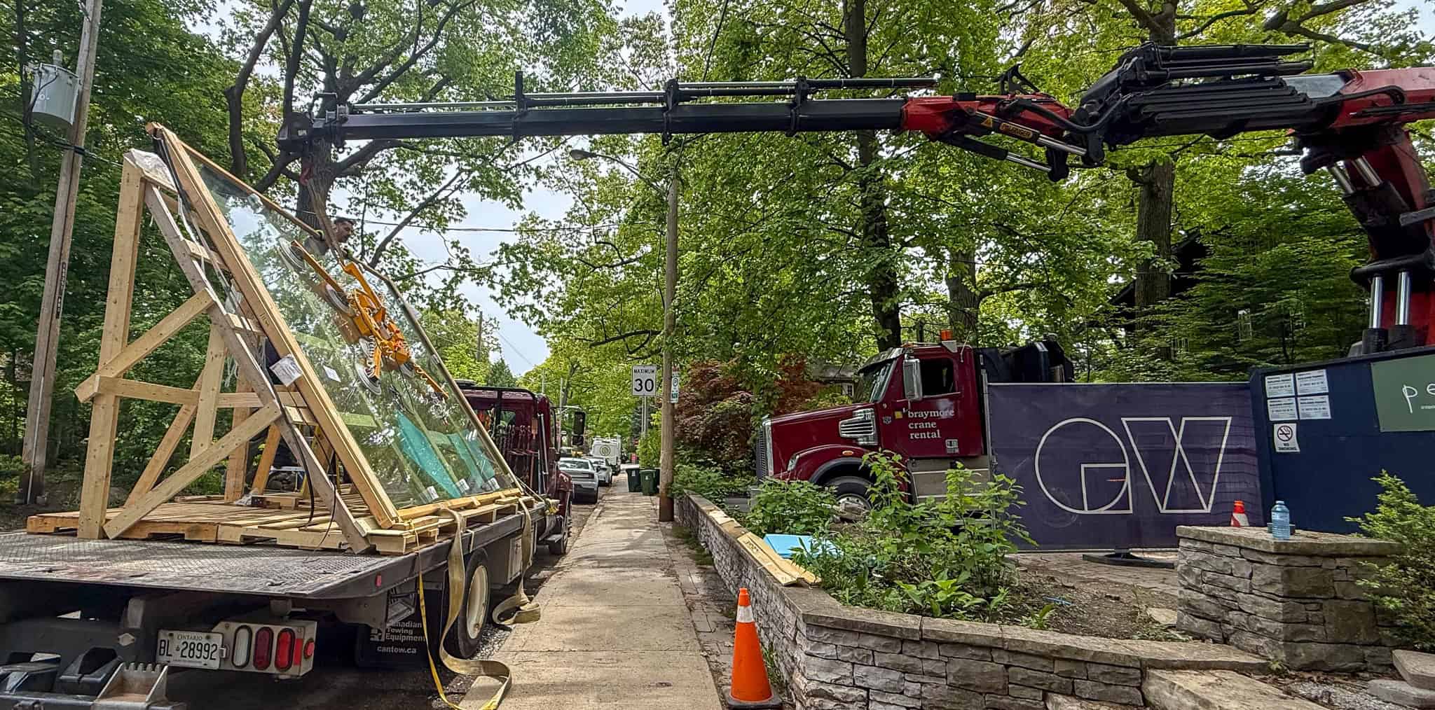 We are using a glass manipulator to lift an extra large window off a delievery truck.