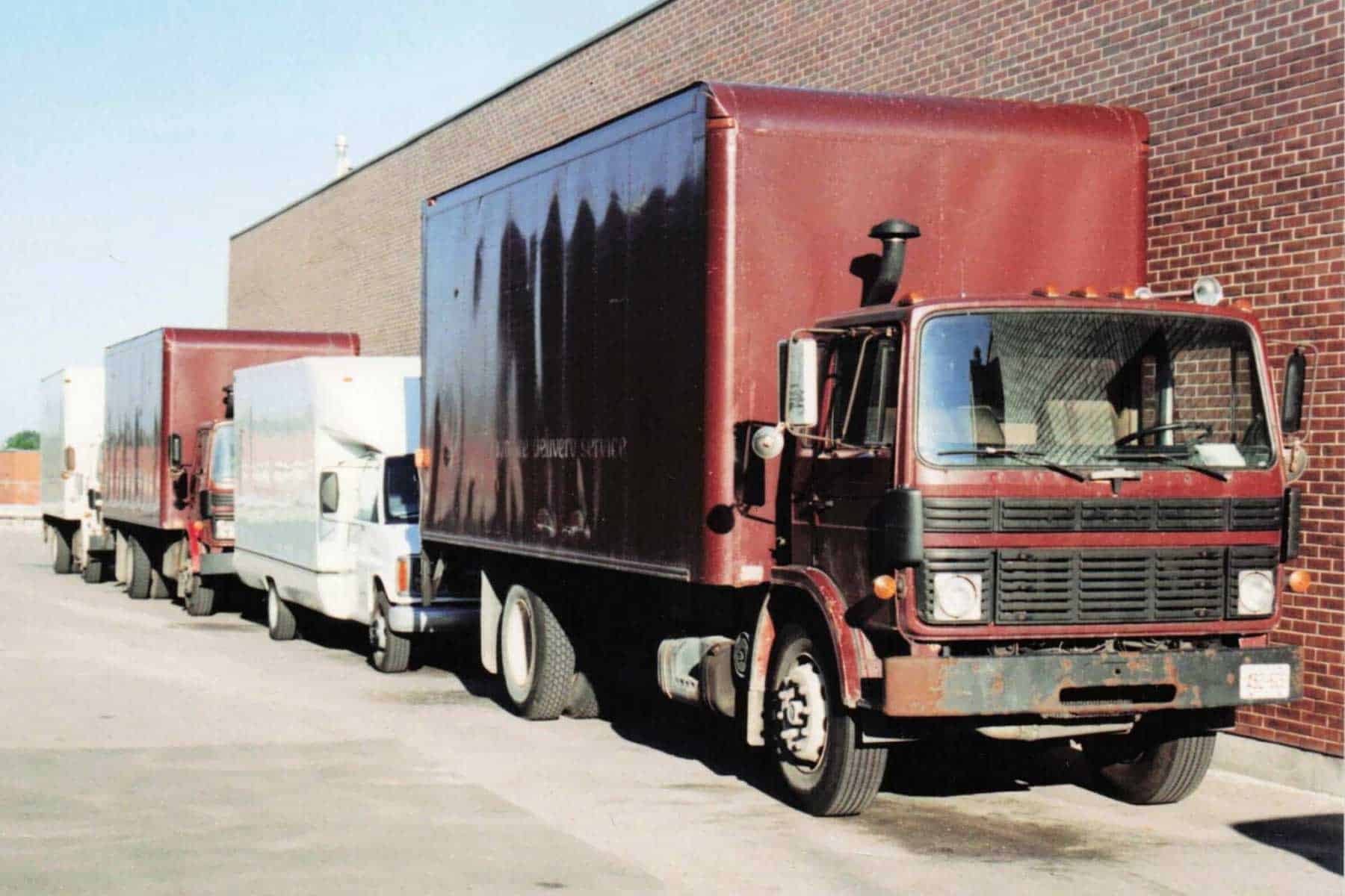Braymore's early truck fleet parked outside their warehouse