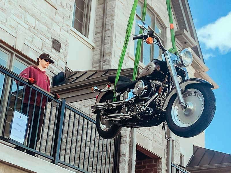 Craning a motor cycle onto a balcony