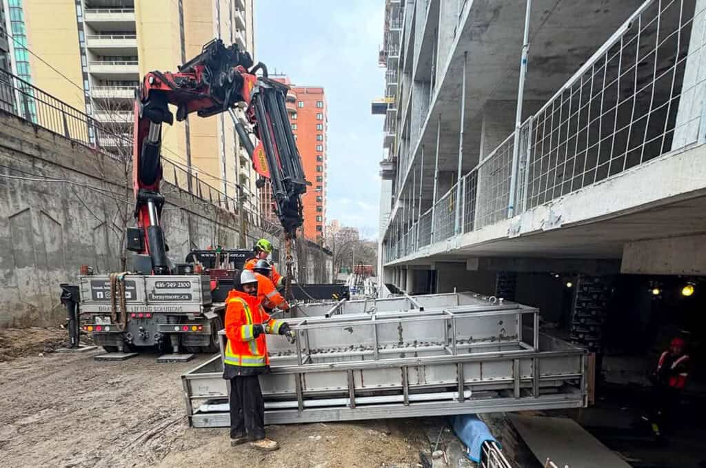 Craning a water feature on a construction site in Toronto.