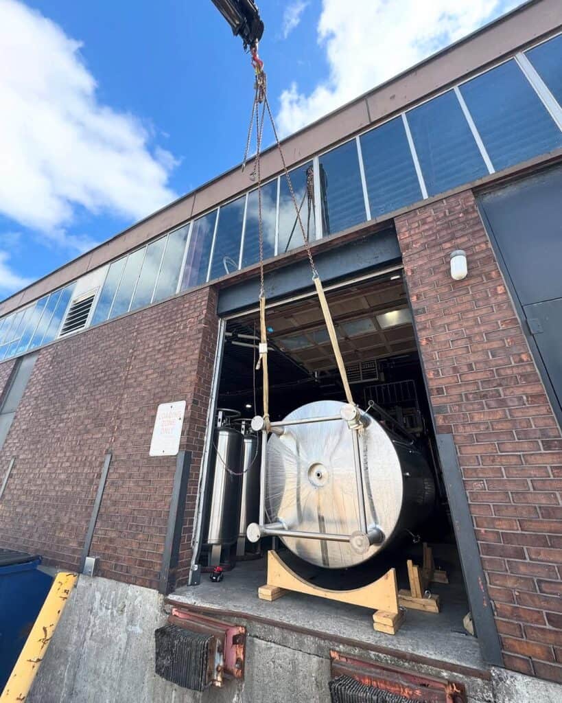Crane brewery silo into warehouse.