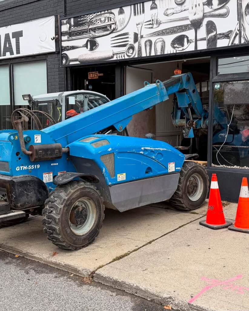 We are using a telehandler to lift a 3500 pound pizza oven through a large restaurant window.