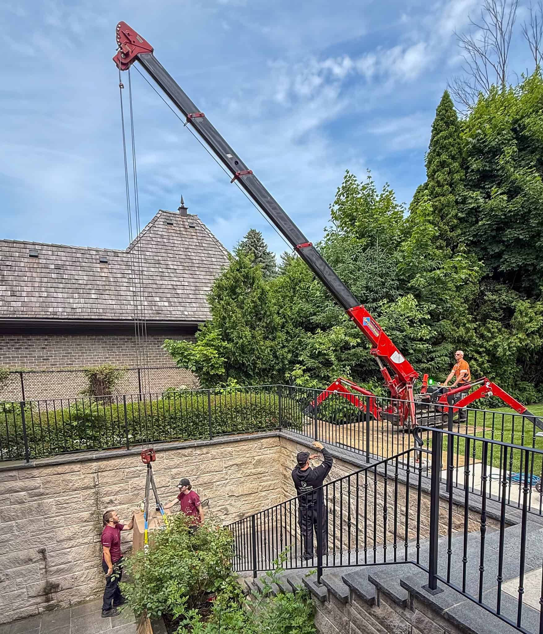 We are using a SpyderCrane to lower a 1200 pound safe to a walkout basement entrance.