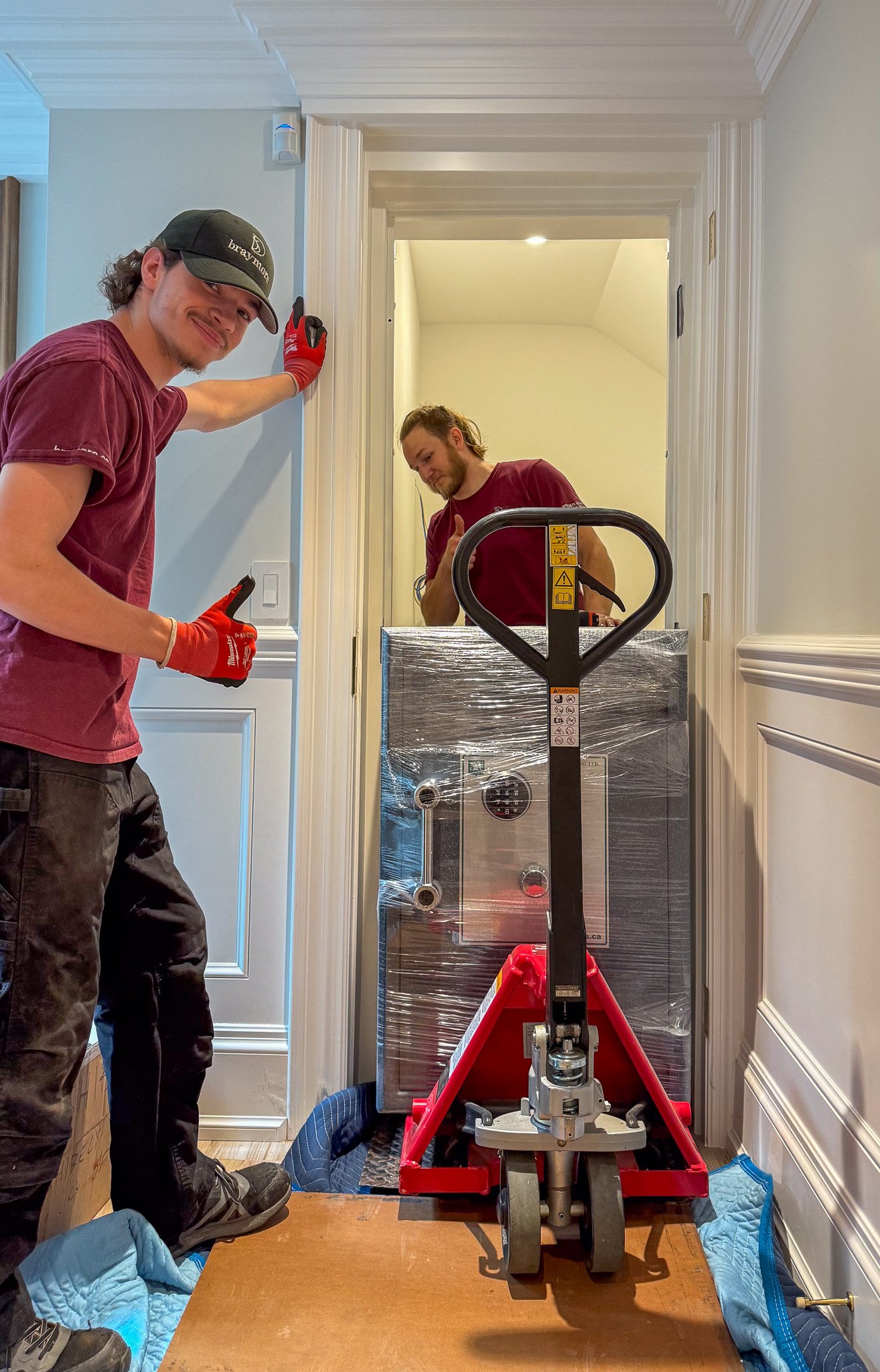Rolling a 1200 pound safe into a storage room.