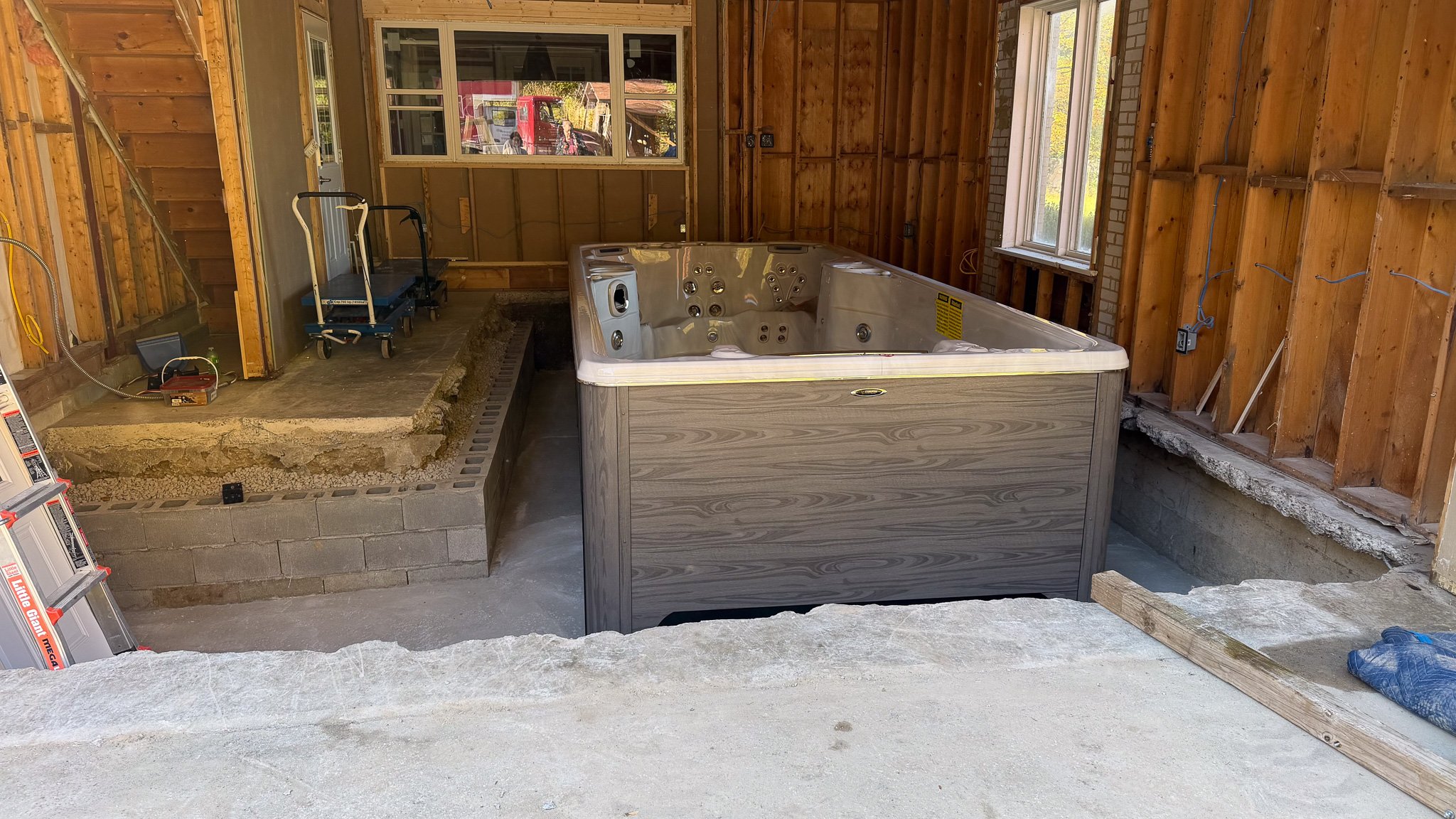 Swim Spa in a garage pit.