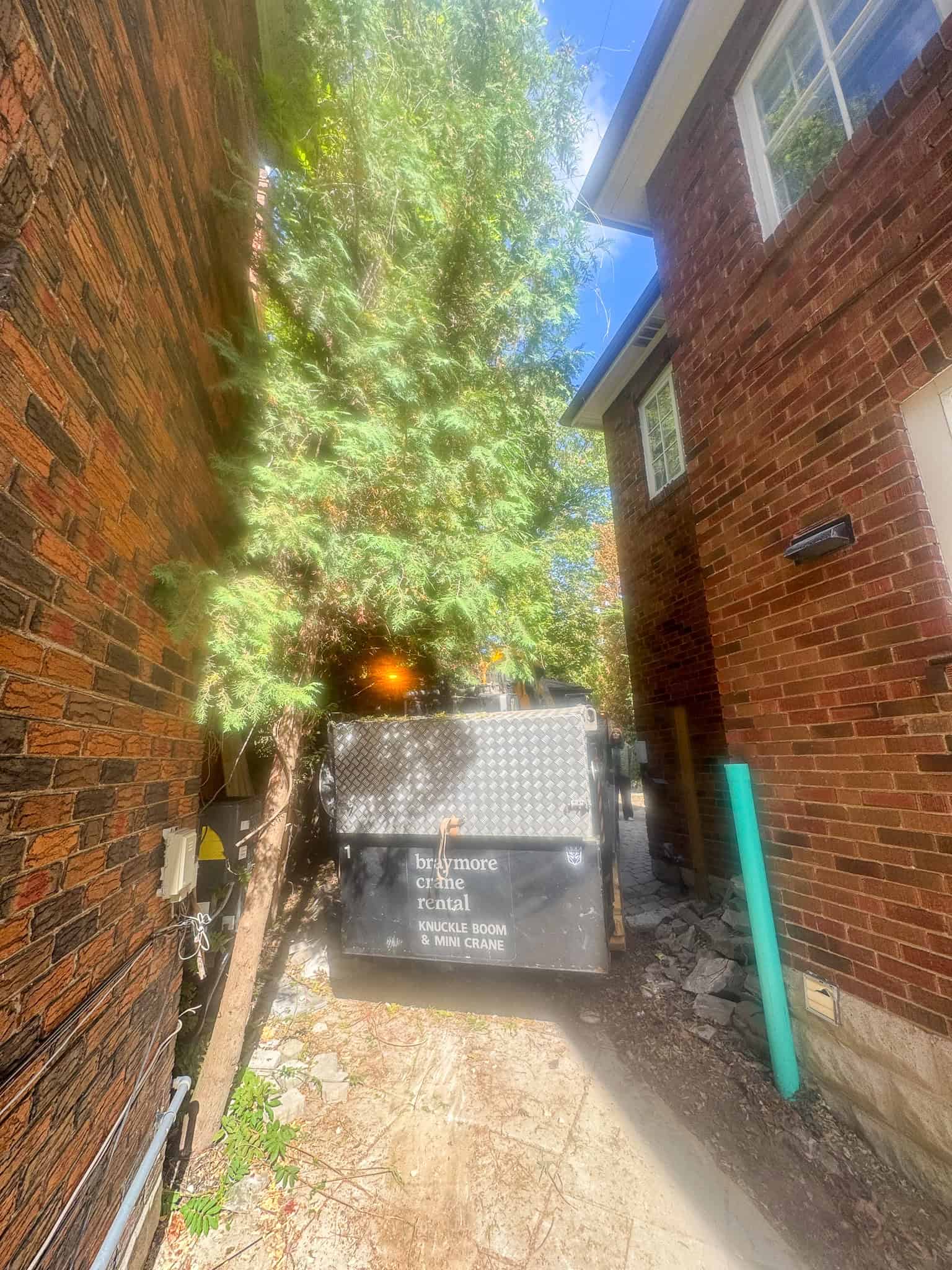 CWE315 Mini Crane turning into the backyard.