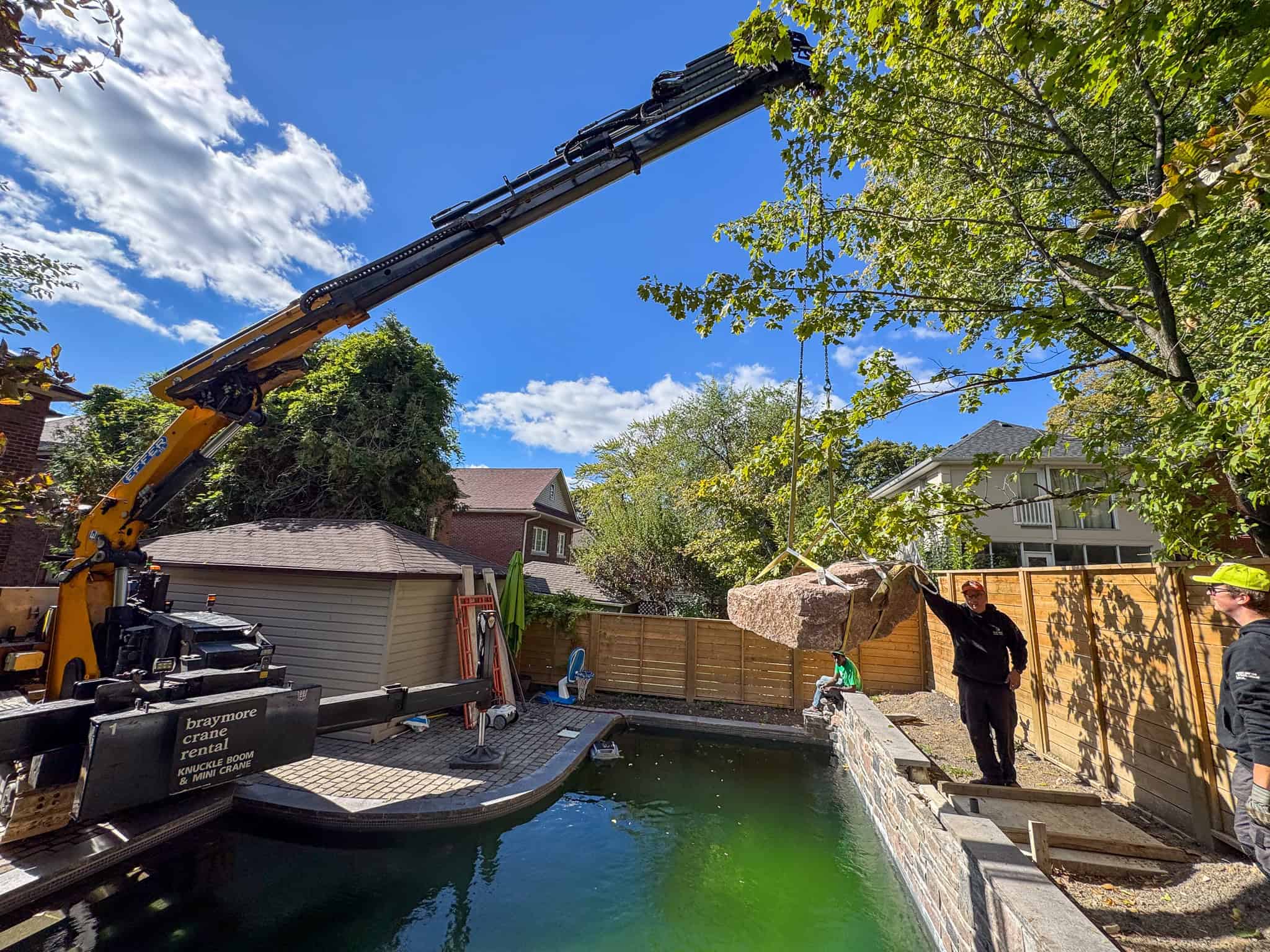 Landing Rock into water feature with the crane.